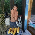 kai grilling corn (its popping!)